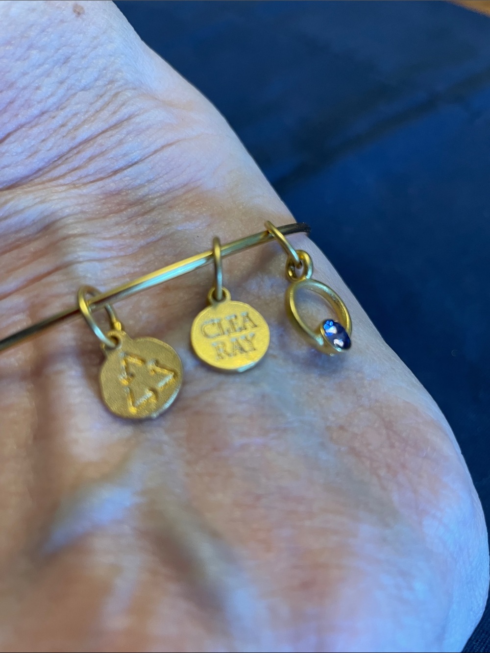 Clea Ray Gold-Tone Charm Bangle Bracelet with Blue Accent Charm